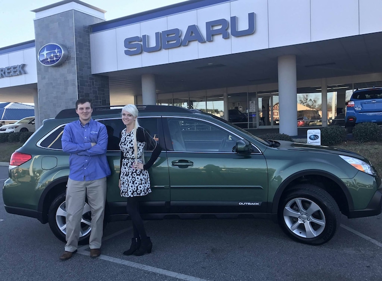 John and Sales Advisor Ava with his CPO 2014 Outback!.jpg