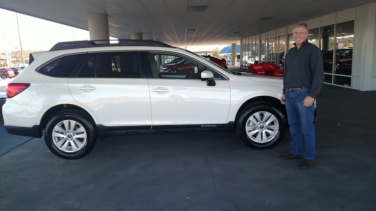 Timothy Johnson with the 2017 Outback he purchased to surprise his wife Marty on Christmas morning!.jpg