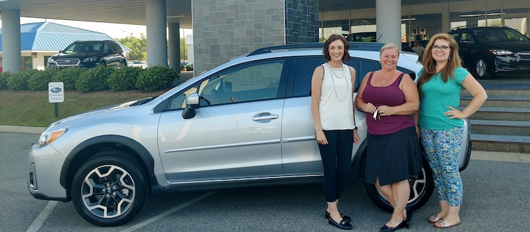 Heather with Finance Manager Kelly (L) and Sr Sales Advisor Emily (R) in front of her new 2017 Crosstrek.jpg