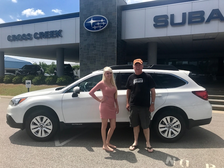 Mr. Sutton with Sales Advisor Ava in front of his 2017 Outback.JPG