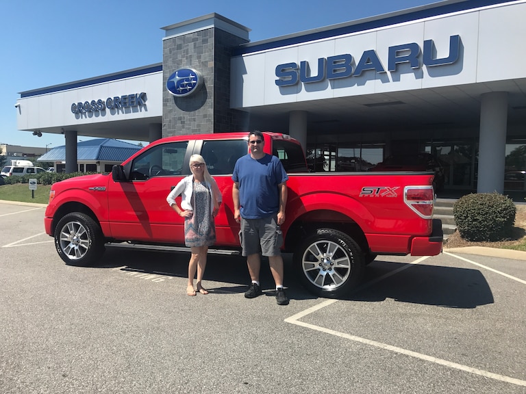 Jason with Sales Advisor Ava in front of his 2014 Ford F-150 #crosscreekpreowneds.jpg