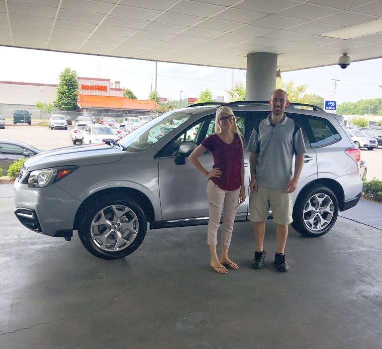 Eric with Sales Advisor Ava in front of his new 2017 Forester Touring.jpg