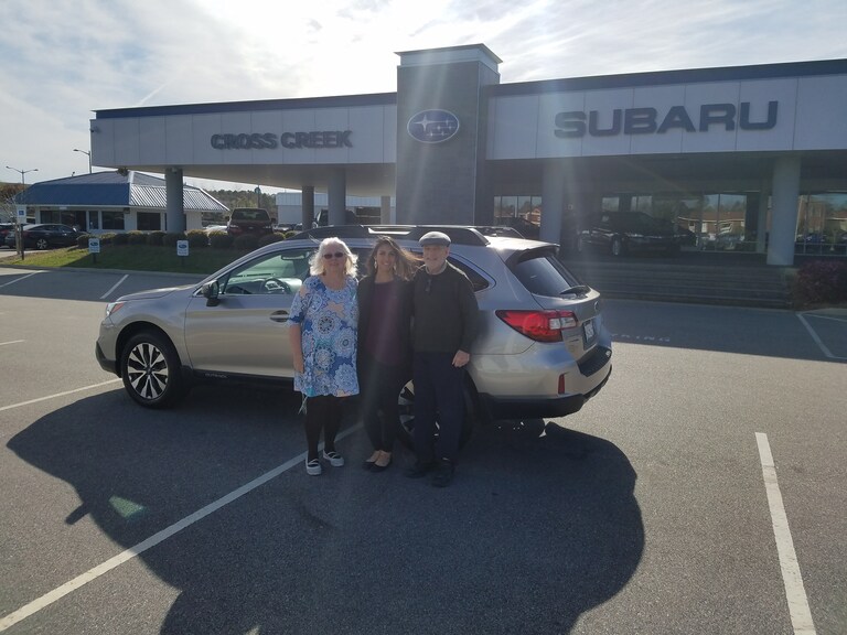 Mr & Mrs Miller in front of their CPO Outback with Sales Advisor Leidy Rhines.jpg