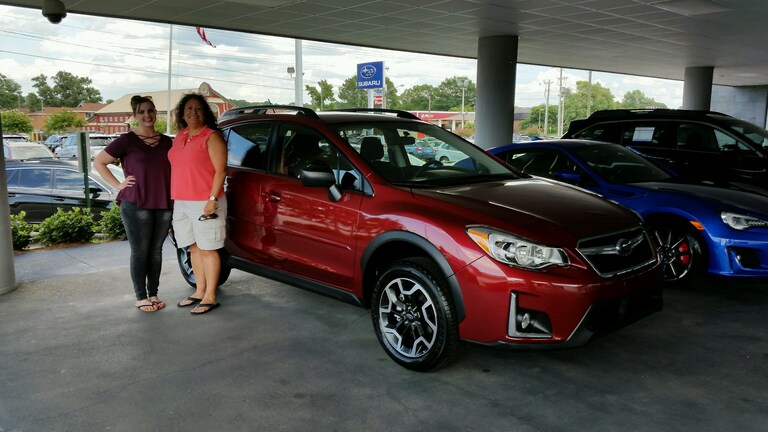 Violet and her new 2017 Subaru Crosstrek with Delivery Specialist Brittany.jpg