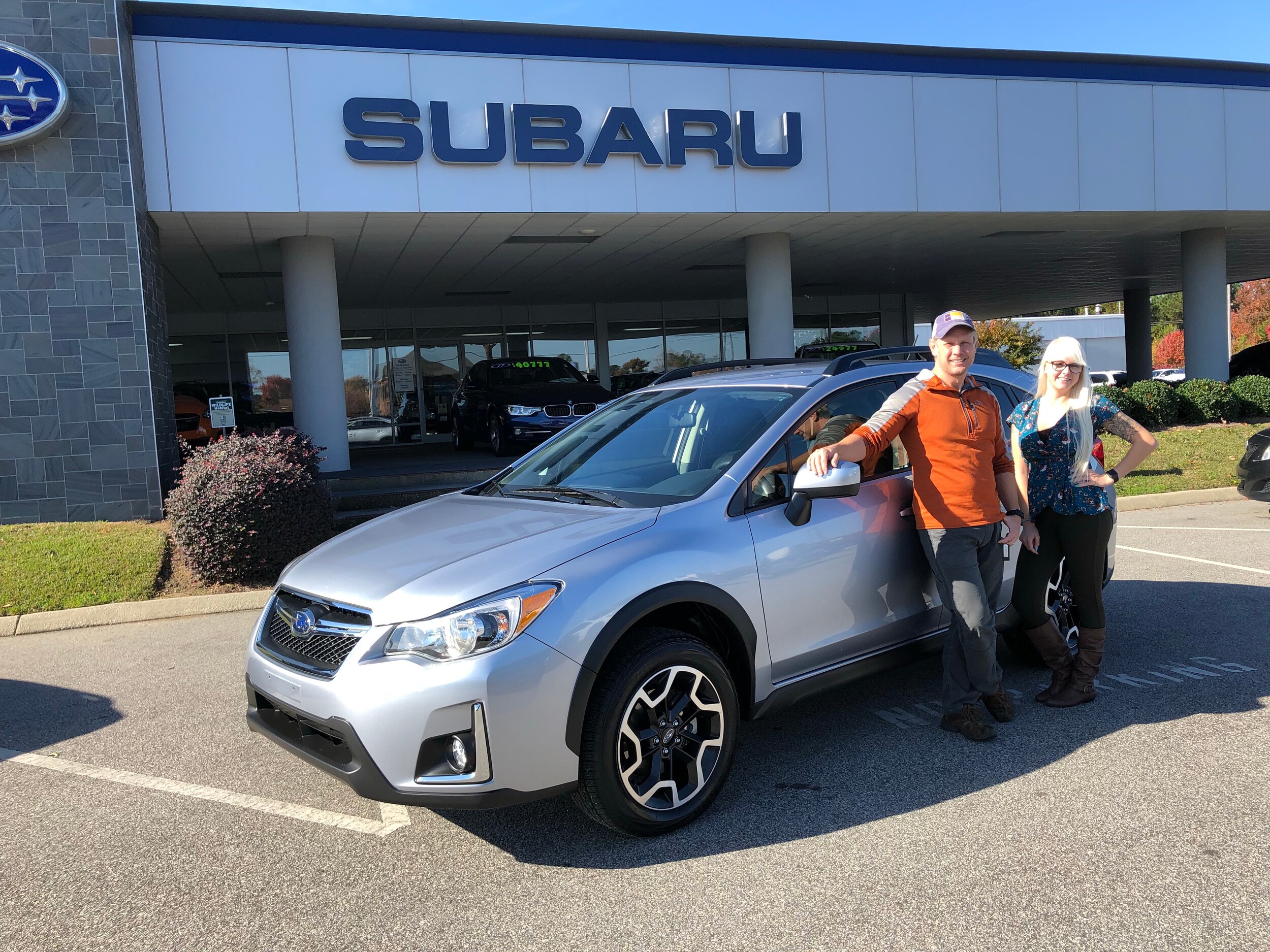 James with Sales Advisor Ava in front of his Crosstrek.jpg