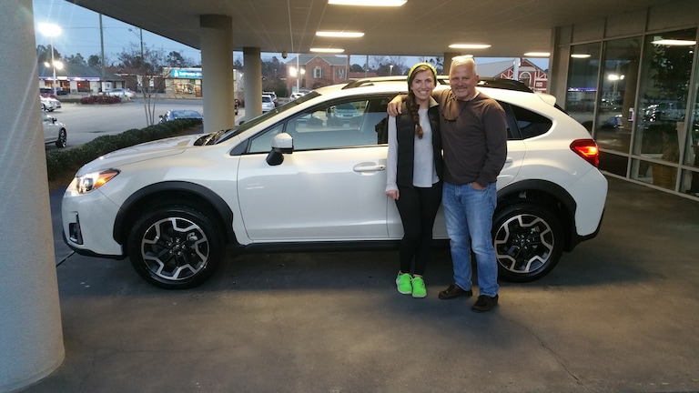 Annie Juergens with her first new vehicle purchase - a 2016 Crosstrek.jpg