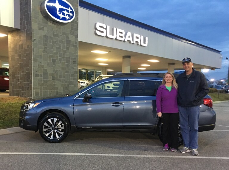 Mr. & Mrs. Clark in front of their first Subaru - a 2017 Outback!.JPG