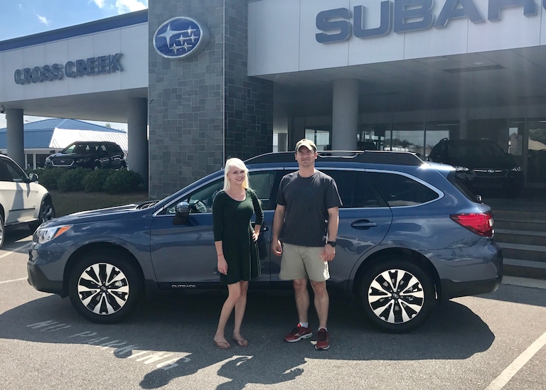 Brandon with Sales Advisor Ava in front of his new 2017 Outback.JPG