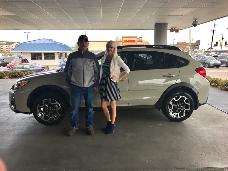 Christopher Boone with Sales Advisor Ava Kunkel in front of his new 2017 Crosstrek.JPG