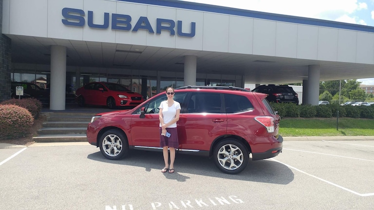 Amy in front of her new 2017 Forester.jpg