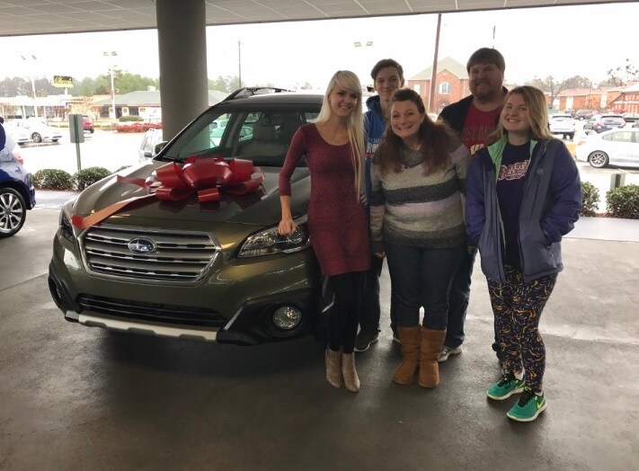 The Gorski family with Sales Advisor Ava and their new 2017 Outback.PNG