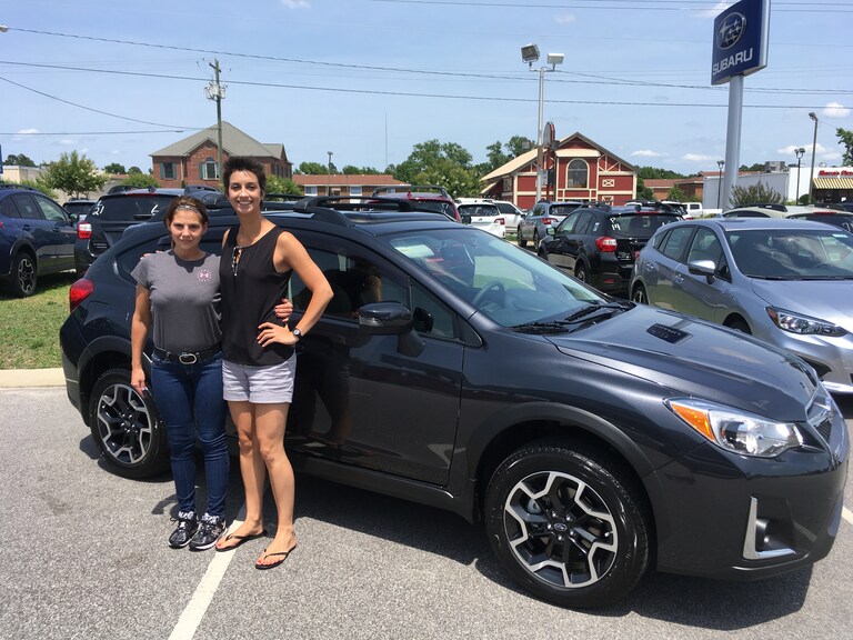 Megan with Sales Advisor Katey in front of her dream car - the 2017 Crosstrek!.JPG