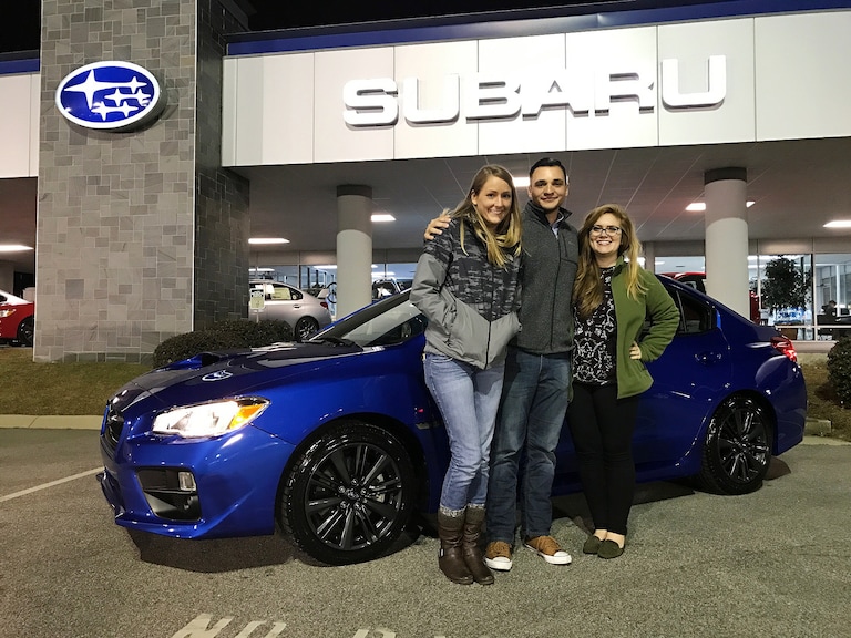 Jessi and Phil with Senior Sales Advisor Emily Bracey in front of Phil's brand new 2017 WRX.jpg