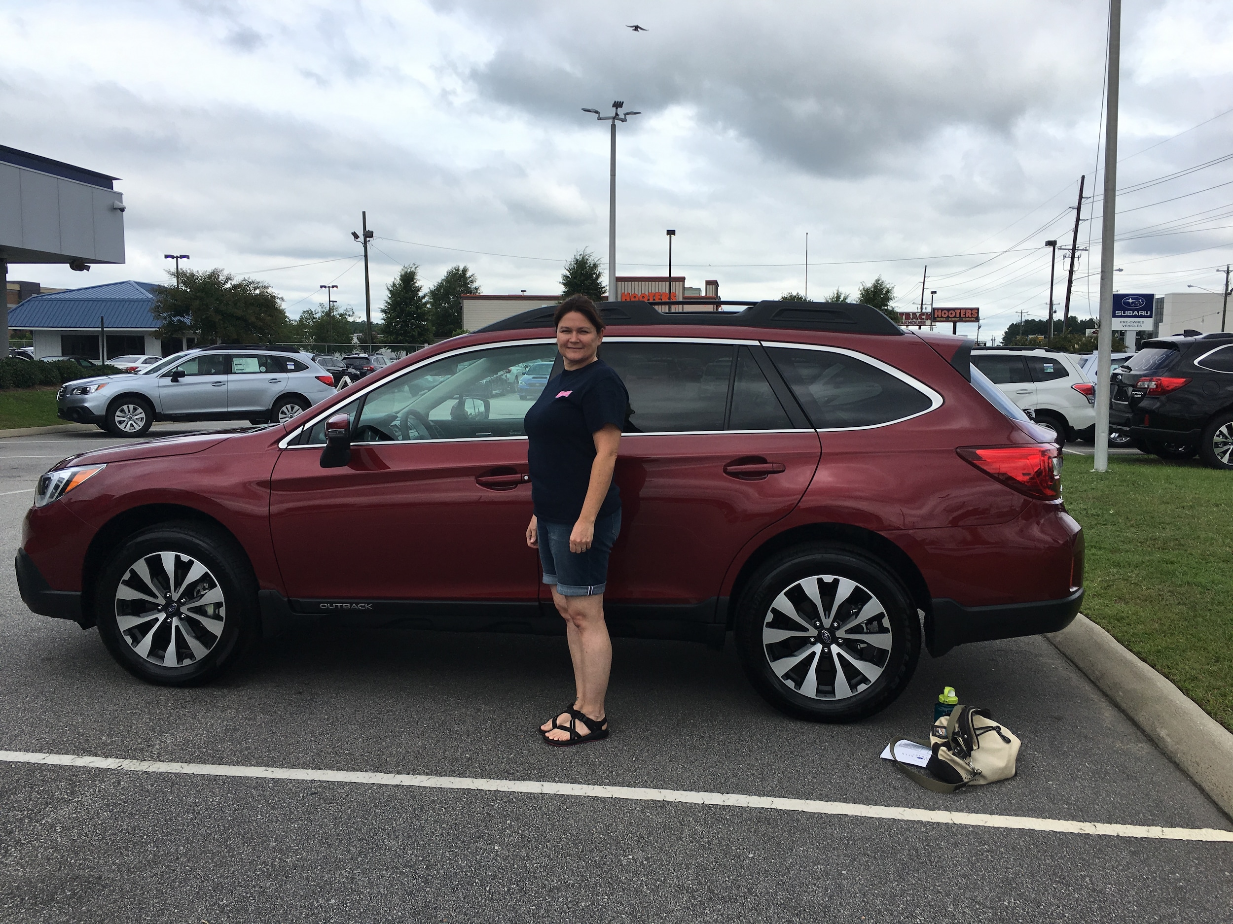 Yvonne with her first Subaru - a 2017 Outback.JPG