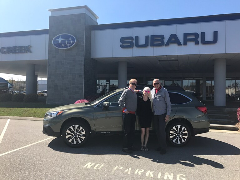 Bob (R) Lynn (L) and Sales Advisor Ava in front of their new 2017 Outback.JPG
