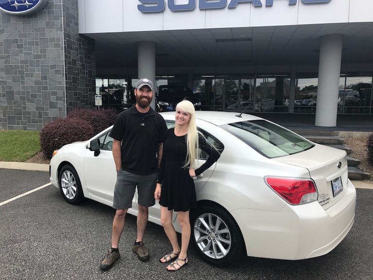 Adam with Sales Advisor Ava in front of his 2nd Subaru - a 2012 Impreza!.JPG