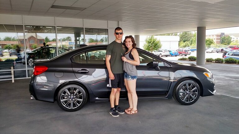 Busch family with their first Subaru, a 2017 WRX.jpg