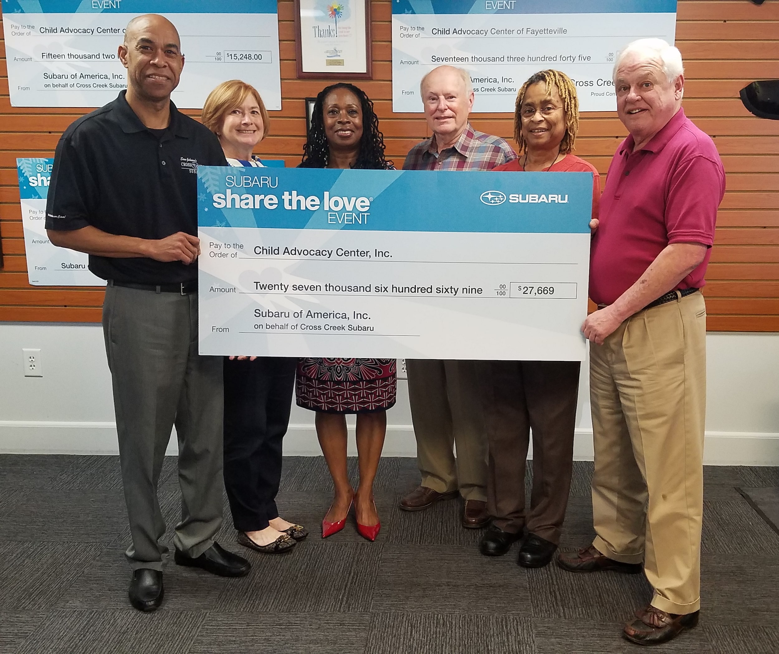Cross Creek Subaru presenting donation to CAC.jpg
