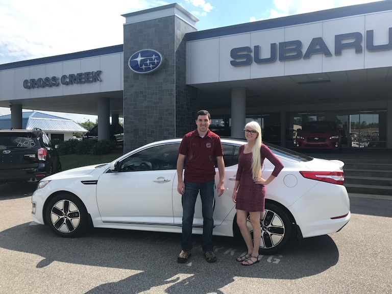 Jacob with the 2012 Kia Optima Hybrid he purcahsed from Sales Advisor Ava!.jpg