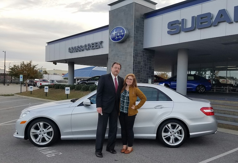 Earl Jones and Senior Sales Advisor, Emily Bracey, with Earl's new Mercedes-Benz!.jpg