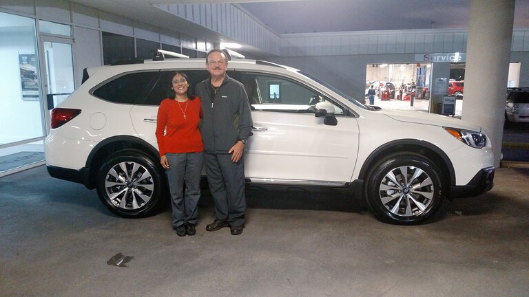 Tara & Johnnie Jones with their new 2017 Outback.jpg