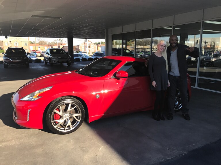 Anthony with Sales Advisor Ava in front of his new ride and retirement gift to himself - a 2014 Nissan 370z.JPG