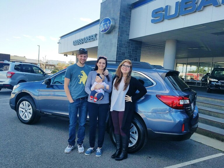 Emily, Ed & Ellie Jones with Sales Advisor Emily Bracey in front of their 2017 Outback.jpg