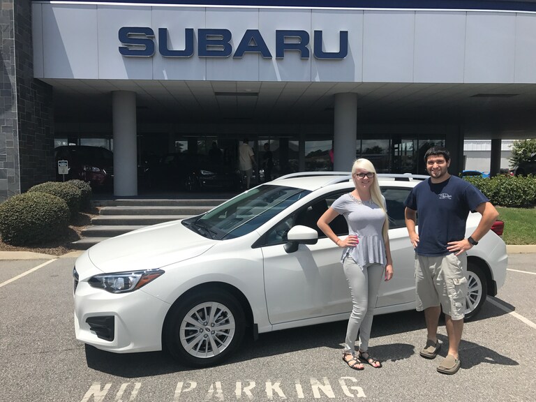 Matt pictured with Sales Advisor Ava in front of his new 2017 Impreza.jpg