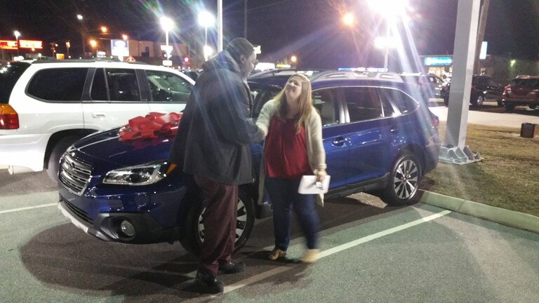 Sarah Williford with Sr Sales Advisor, Guy Jordan. She purchased her first new car - this 2017 Outback - as a gift to herself for graduating pharmacy school!.jpg