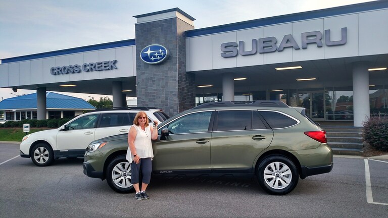Anne Stoloff with her new Subaru Outback and her previous Outback! #Subaruforlife.jpg
