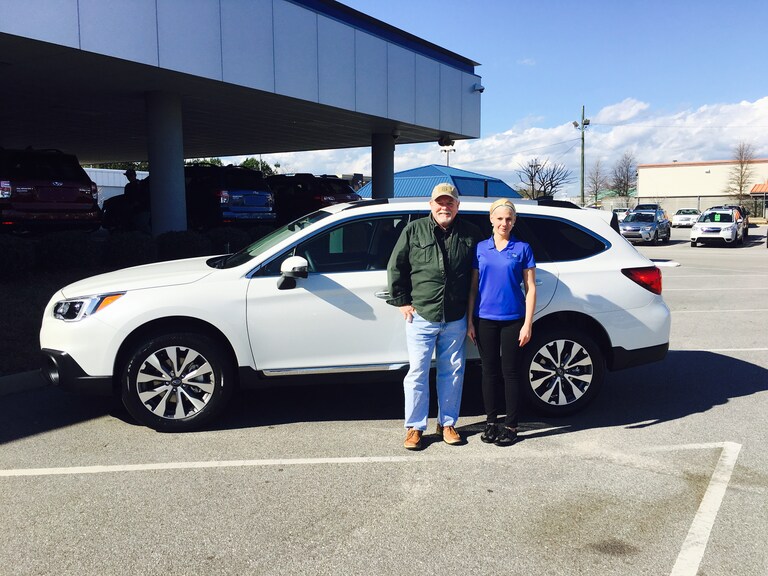David Baker with Sales Advisor Katey Meeks in front of his new 2017 Outback 3.6R Touring.jpg