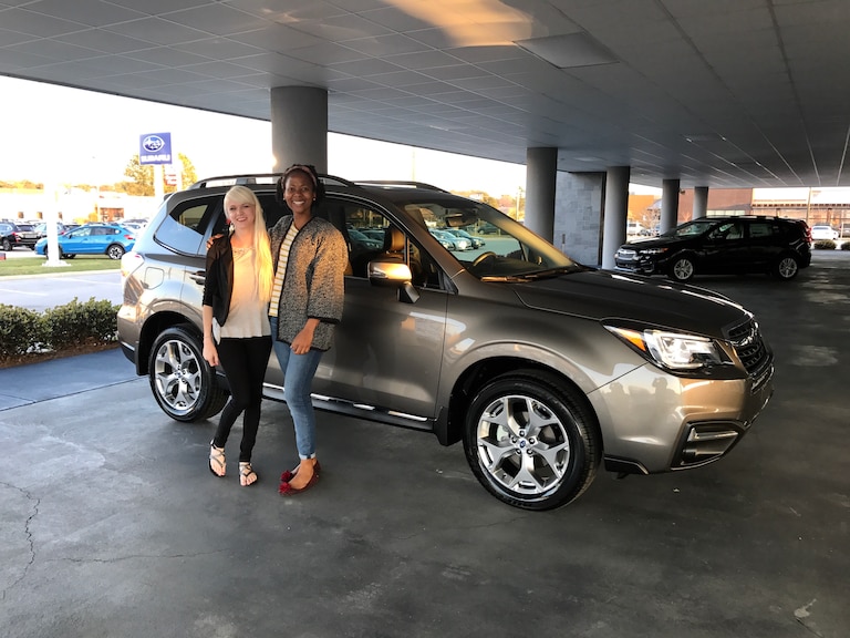Heather with Sales Advisor Ava in front of her 2017 Forester Touring.JPG