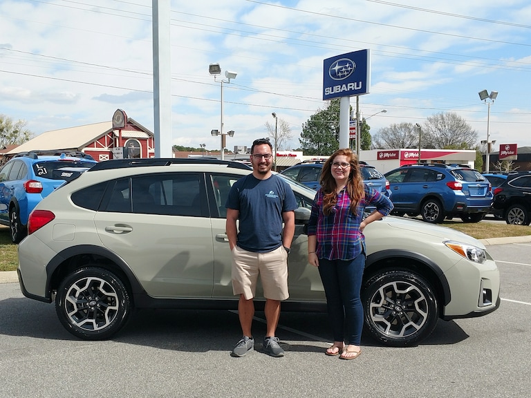 Justin Gill with Sr Sales Advisor Emily Bracey in front of his 2017 Crosstrek Manual!.jpg