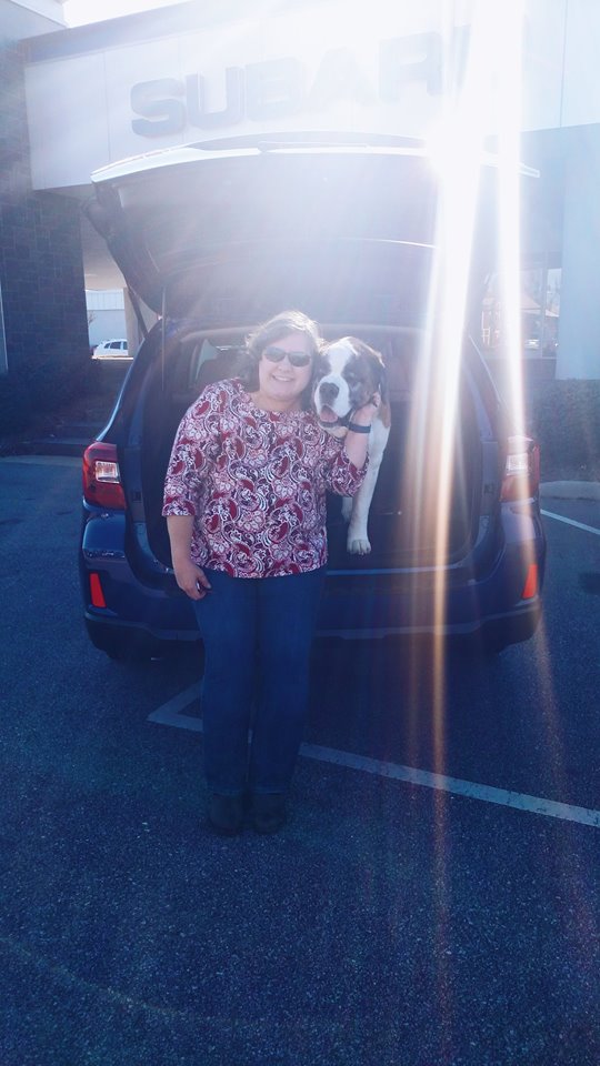 Christine - and her St. Bernard, Mystic - with her 2016 Outback.jpg