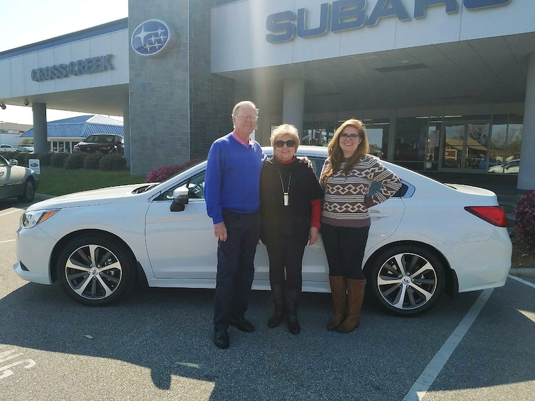Mr & Mrs Black with Sales Adivosr Emily Bracey in front of their new 2017 Legacy.jpg