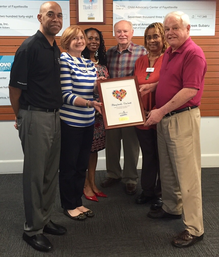 CAC presenting Cross Creek Subaru with a thank you letter.JPG
