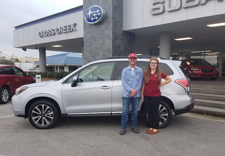 TJ Sealey with Sr Sales Advisor Emily Bracey and his new 2017 Forester XT Touring.jpg