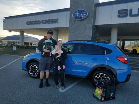 Ashli & Jacob with their family and new 2016 Crosstrek.jpg