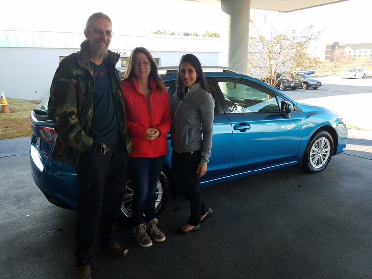 Vickie & Russell Fishel with the first 2017 Impreza sold at Cross Creek Subaru and Advisor Leidy Rhines.jpg