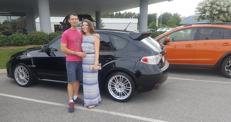 Mr & Mrs Glow in front of their third Subaru - a 2008 Impreza WRX STI Hatchback!.jpg