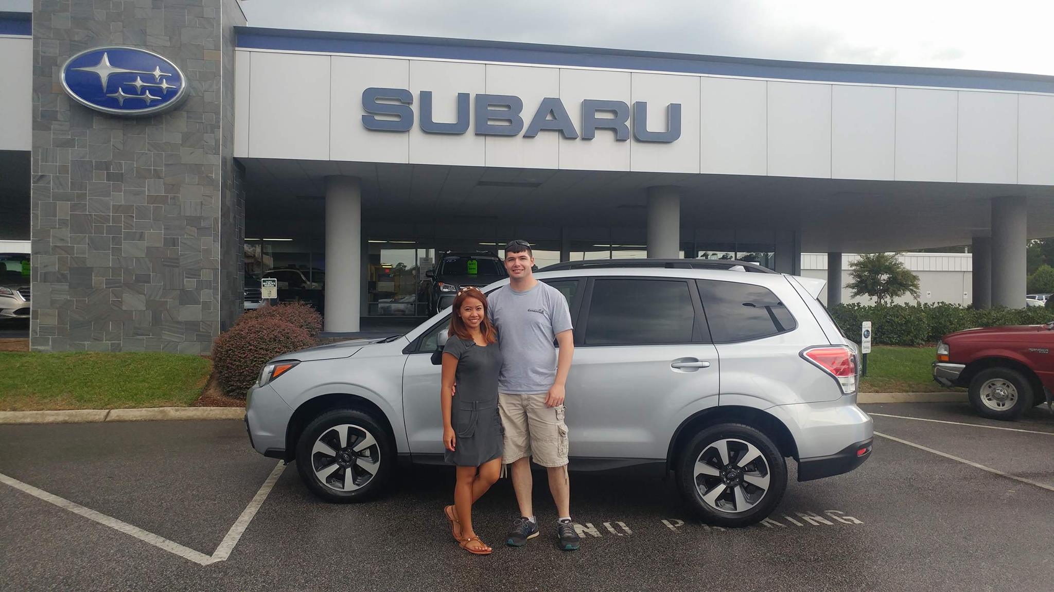 Scott & Esther with their first Subaru - a 2017 Forester.jpg