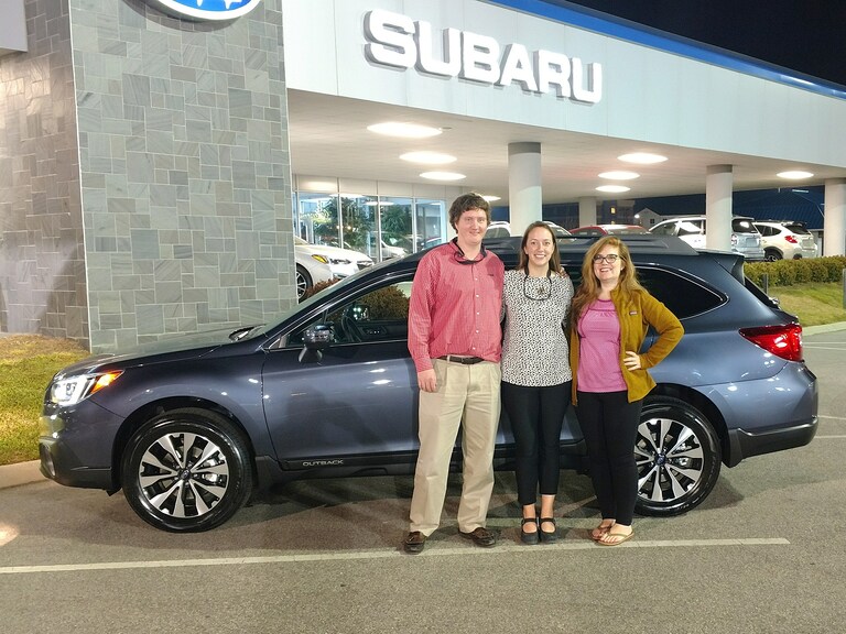 Laura & Walt Williford with Sr Sales Advisor Emily in front of their new 2017 Outback.jpg