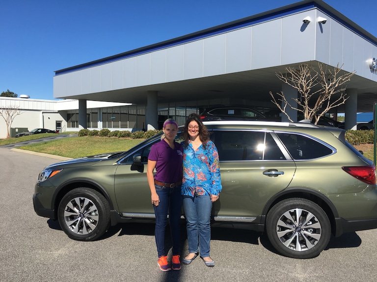 Deborah and Sales Advisor Katey in front of Deborah's birthday present to herself - a 2017 Outback Touring!.JPG