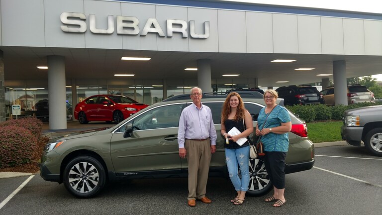 Sara, her mom and Sales Advisor Myc in front of Sara's new 2017 Outback.jpg