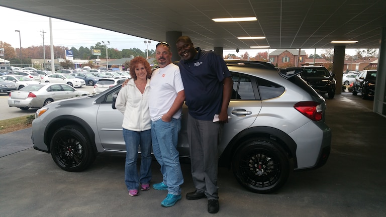 Shelia and Mike with Senior Sales Advisor, Guy Jordan buying her 3rd Subaru - a Crosstrek!.jpg