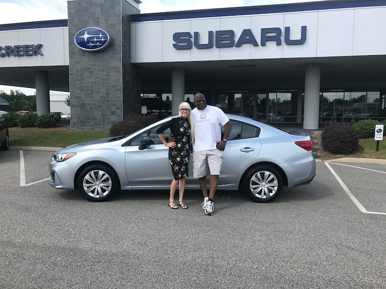 Ricky with Sales Advisor Ava in front of his new 2017 Impreza.JPG