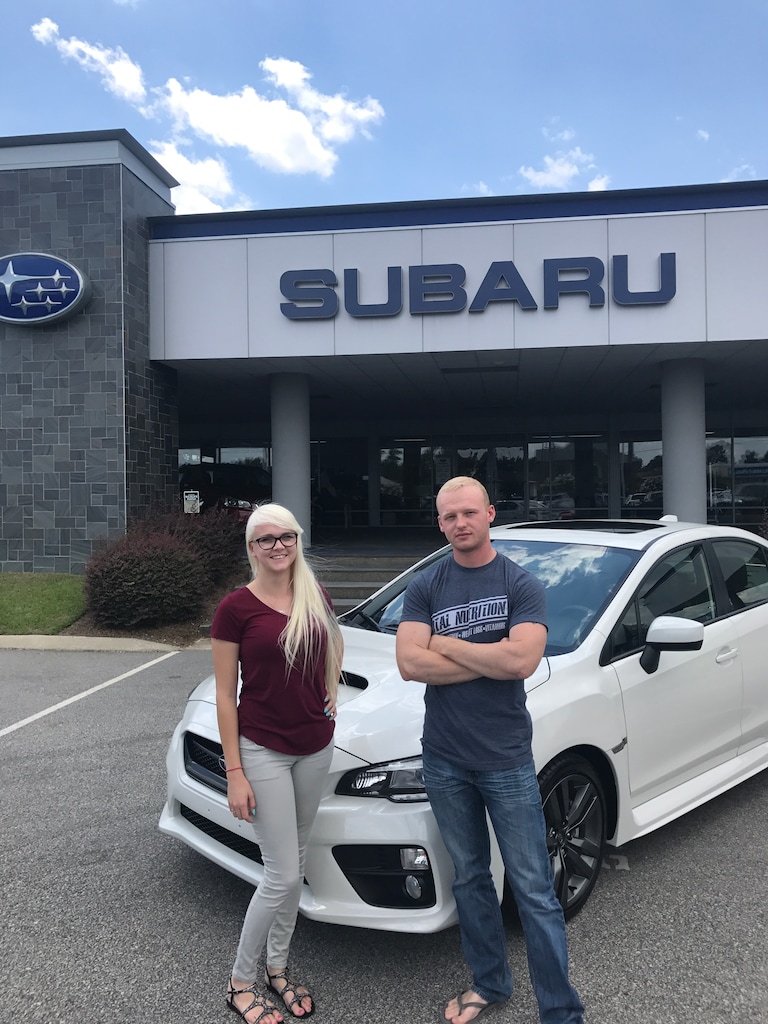 Thomas with Sales Advisor Ava in front of his new 2017 WRX.JPG