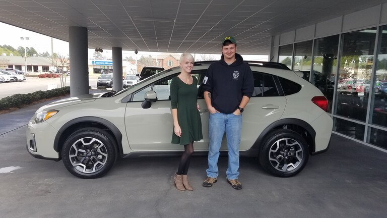 Joshua Barnard with his new 2017 Crosstrek purchased for his wife (not pictured) and their first born child. Sales Advisor Ava pictured.jpg
