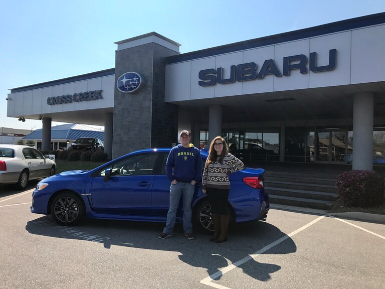 Charles with Sr Sales Advisor Emily in front of his new 2017 WRX.JPG