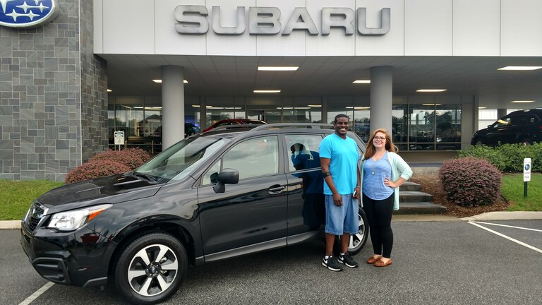 Jason with Sales Advisor Emily in front of his new 2017 Forester.jpg